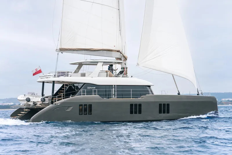 Candy Yacht Photos Pics Luxury Sunreef 70 sailing catamaran from 2021 cruising on open water.