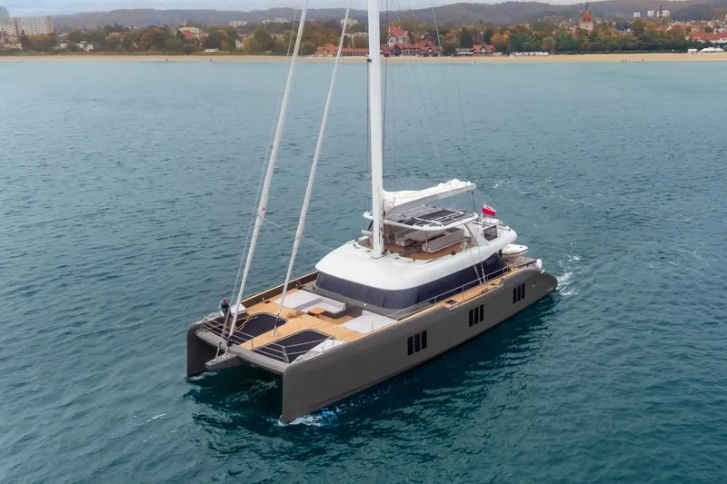 Candy Yacht Photos Pics Luxury Sunreef 70 catamaran sailing on open water, 2021 model.