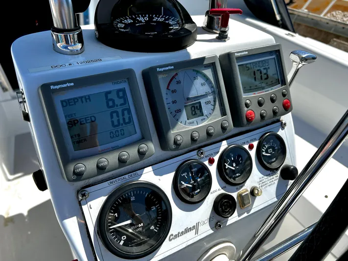Alcyone Yacht Photos Pics Control panel of a 2007 Catalina 350 yacht with navigation instruments and gauges.