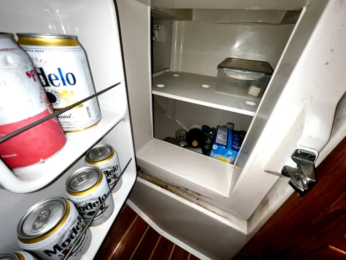 Alcyone Yacht Photos Pics Refrigerator inside 2007 Catalina 350 yacht, stocked with Modelo beer and various beverages.