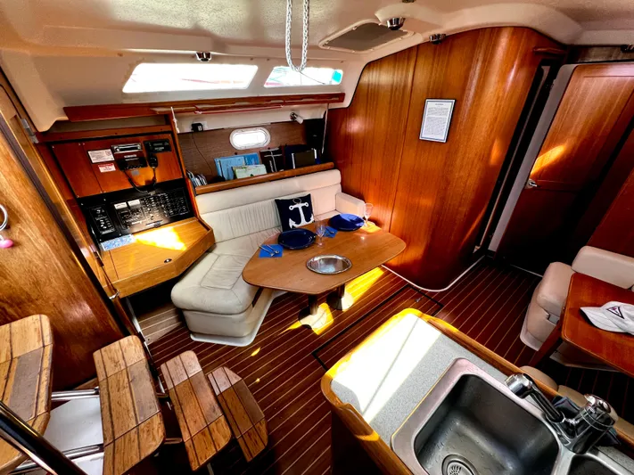 Alcyone Yacht Photos Pics Interior of 2007 Catalina 350 yacht with wooden finish and cozy seating area.