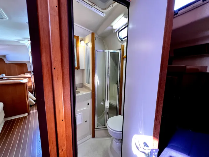 Alcyone Yacht Photos Pics Interior of 2007 Catalina 350 yacht featuring bathroom and living area.