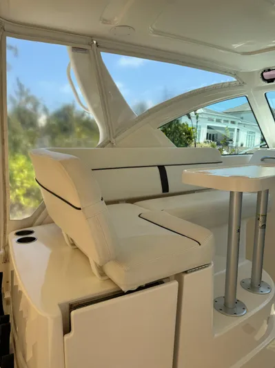  Yacht Photos Pics 2012 Tiara Yachts 3100 Open interior with white seating and table.