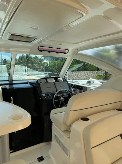  Yacht Photos Pics Interior of 2012 Tiara Yachts 3100 Open, featuring helm and seating area.