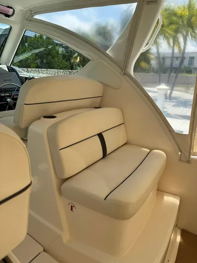  Yacht Photos Pics 2012 Tiara Yachts 3100 Open interior with beige seating and window view.