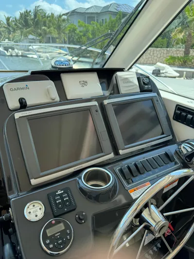  Yacht Photos Pics 2012 Tiara Yachts 3100 Open helm with dual displays and navigation equipment.