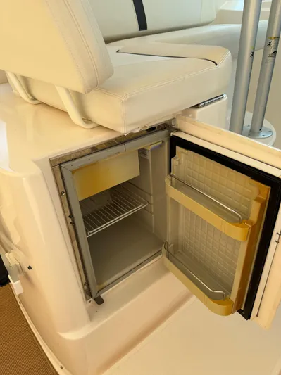  Yacht Photos Pics 2012 Tiara Yachts 3100 Open with open mini fridge under white seating.