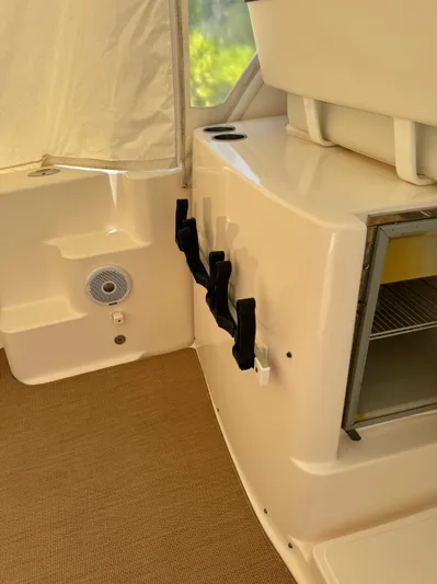  Yacht Photos Pics Interior of 2012 Tiara Yachts 3100 Open, featuring storage and speaker.