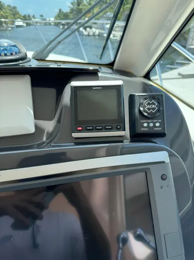 Yacht Photos Pics Dashboard of a 2012 Tiara Yachts 3100 Open with navigation equipment.