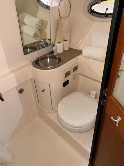  Yacht Photos Pics 2012 Tiara Yachts 3100 Open bathroom with sink, toilet, and mirror.