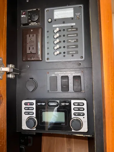  Yacht Photos Pics Control panel inside a 2012 Tiara Yachts 3100 Open, featuring switches and a stereo system.