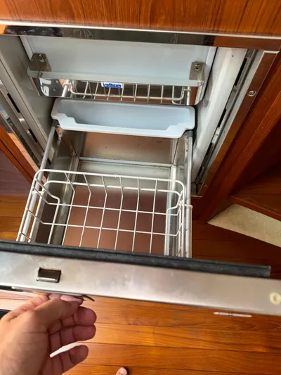  Yacht Photos Pics Open drawer in 2012 Tiara Yachts 3100 Open, showcasing interior storage space.