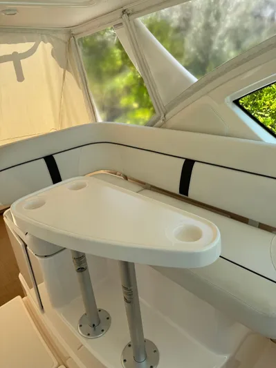  Yacht Photos Pics 2012 Tiara Yachts 3100 Open interior with white seating and table.