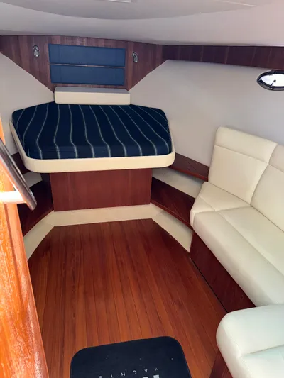 Yacht Photos Pics 2012 Tiara Yachts 3100 Open cabin with wood flooring and cozy seating.