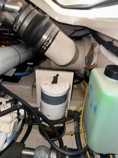  Yacht Photos Pics Engine compartment of a 2012 Tiara Yachts 3100 Open, showing hoses and fluid container.