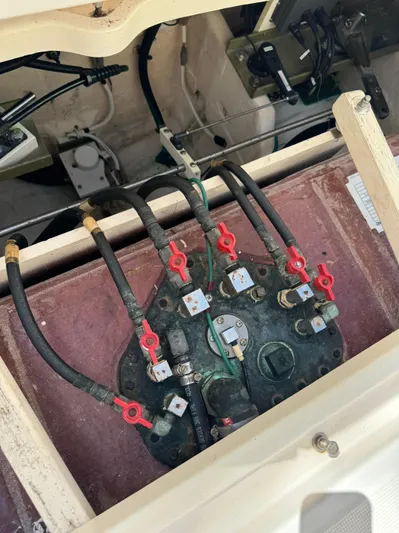  Yacht Photos Pics Engine compartment of a 2012 Tiara Yachts 3100 Open, showing fuel lines and valves.