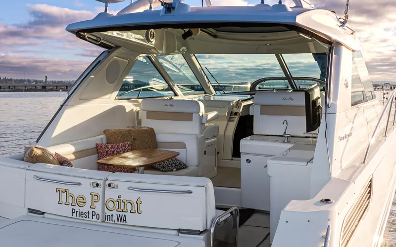  Yacht Photos Pics 2010 Sea Ray Sundancer yacht docked, featuring a luxurious open deck and seating area.