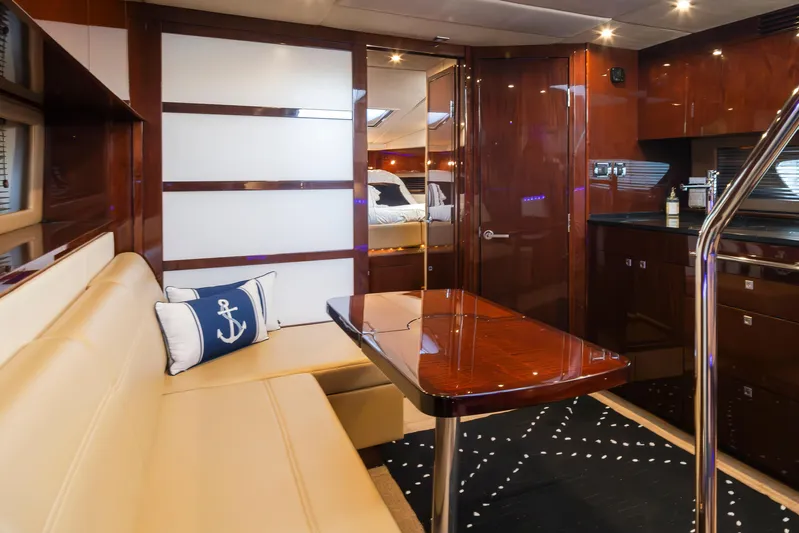  Yacht Photos Pics Luxurious interior of 2010 Sea Ray Sundancer yacht with elegant seating and polished wood finishes.