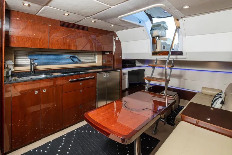  Yacht Photos Pics Luxurious 2010 Sea Ray Sundancer yacht interior with modern kitchen and seating area.