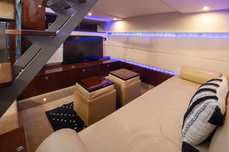  Yacht Photos Pics Luxurious interior of 2010 Sea Ray Sundancer yacht with modern seating and ambient lighting.