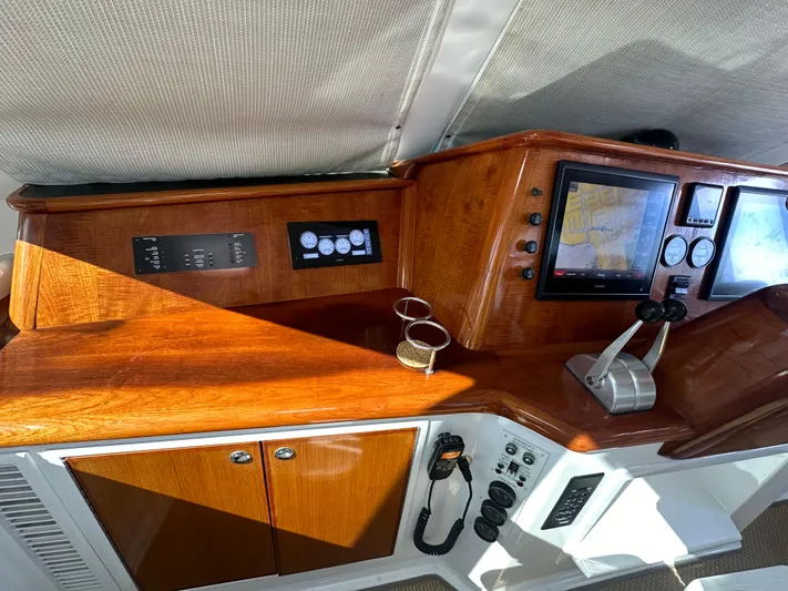 Bebe Yacht Photos Pics 1999 Viking 60 Cockpit Sports Yacht helm with wood finish and navigation instruments.