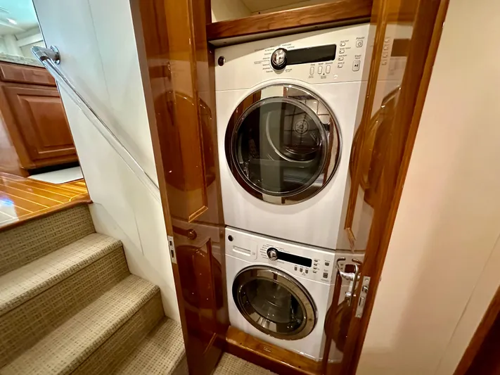 Bebe Yacht Photos Pics Stacked washer and dryer in 1999 Viking 60 Cockpit Sports Yacht laundry area.