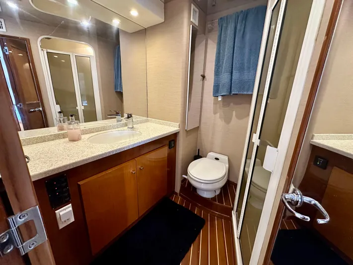 Bebe Yacht Photos Pics Bathroom interior of 1999 Viking 60 Cockpit Sports Yacht with modern amenities.