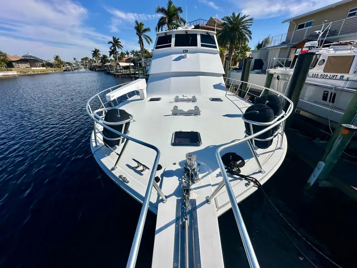 Bebe Yacht Photos Pics 1999 Viking 60 Cockpit Sports Yacht docked in a sunny marina.