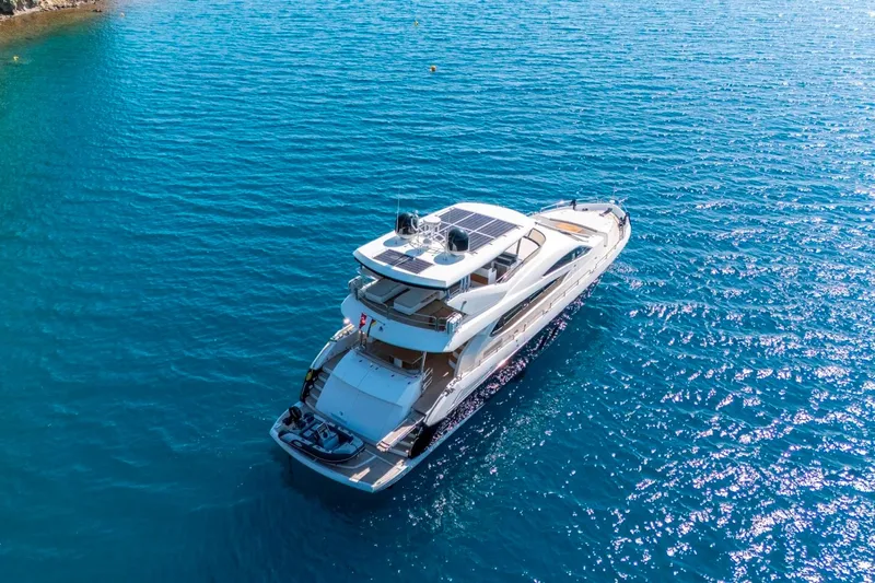  Yacht Photos Pics Luxurious 2011 Sunseeker 80 Yacht cruising on clear blue waters.