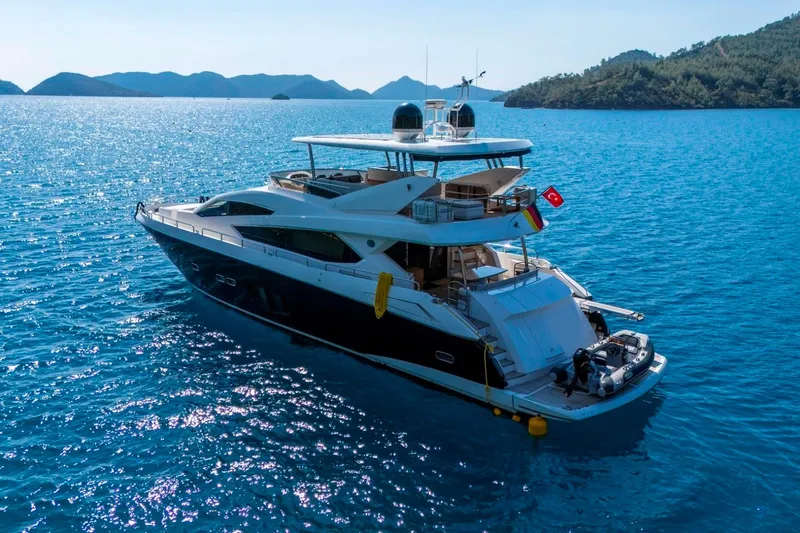  Yacht Photos Pics Luxurious 2011 Sunseeker 80 Yacht cruising in clear blue waters.