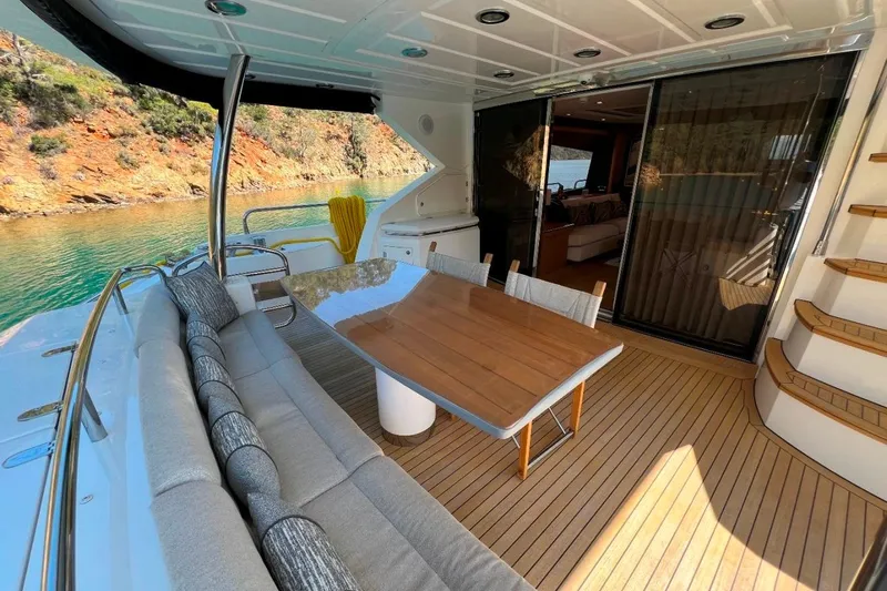  Yacht Photos Pics Luxurious Sunseeker 80 Yacht 2011 with elegant outdoor seating and scenic water view.