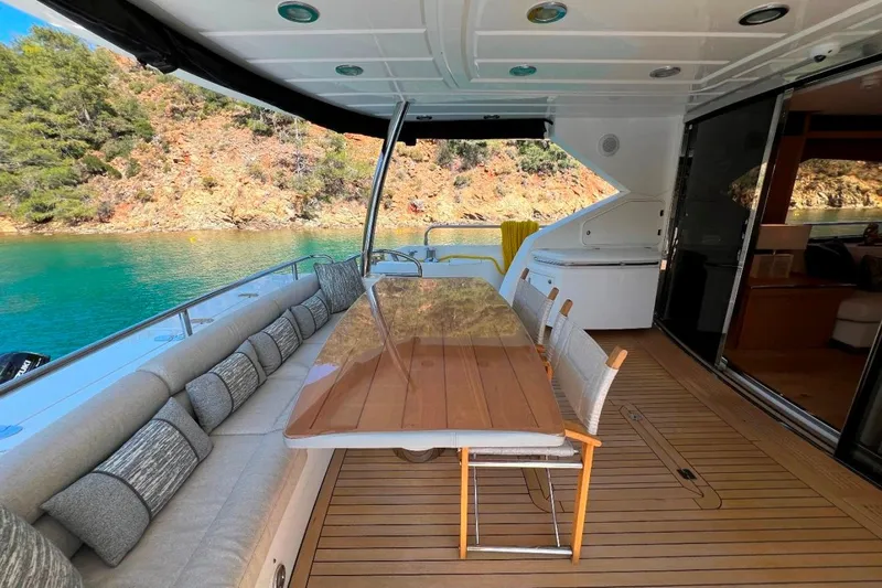  Yacht Photos Pics Luxurious Sunseeker 80 Yacht 2011 deck with elegant seating and scenic water view.