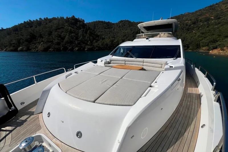  Yacht Photos Pics Luxurious 2011 Sunseeker 80 Yacht with spacious deck, cruising in serene waters.
