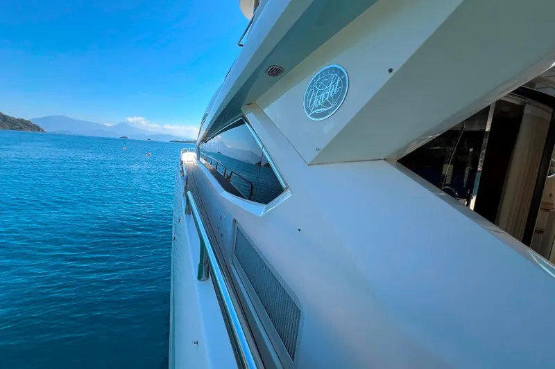  Yacht Photos Pics Side view of a 2011 Sunseeker 80 Yacht on clear blue water.