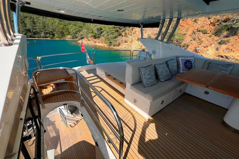  Yacht Photos Pics Luxurious 2011 Sunseeker 80 Yacht deck with seating, overlooking serene turquoise waters.