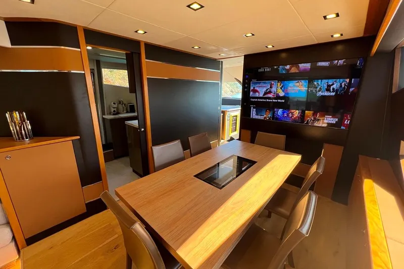  Yacht Photos Pics Luxurious interior of 2011 Sunseeker 80 Yacht with dining area and entertainment system.