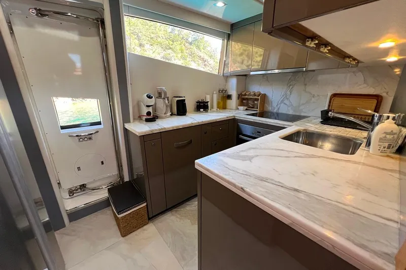  Yacht Photos Pics Luxurious Sunseeker 80 Yacht 2011 kitchen with marble countertops and modern appliances.