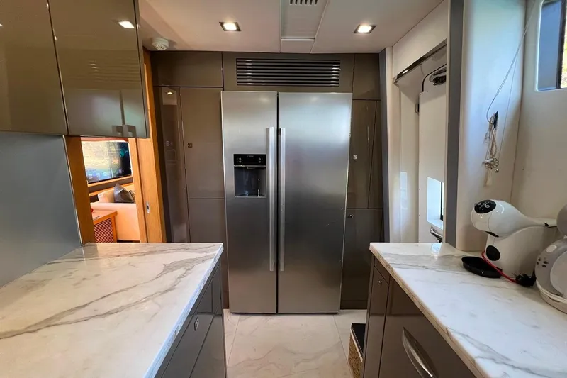  Yacht Photos Pics Modern kitchen interior on a 2011 Sunseeker 80 Yacht with stainless steel appliances.