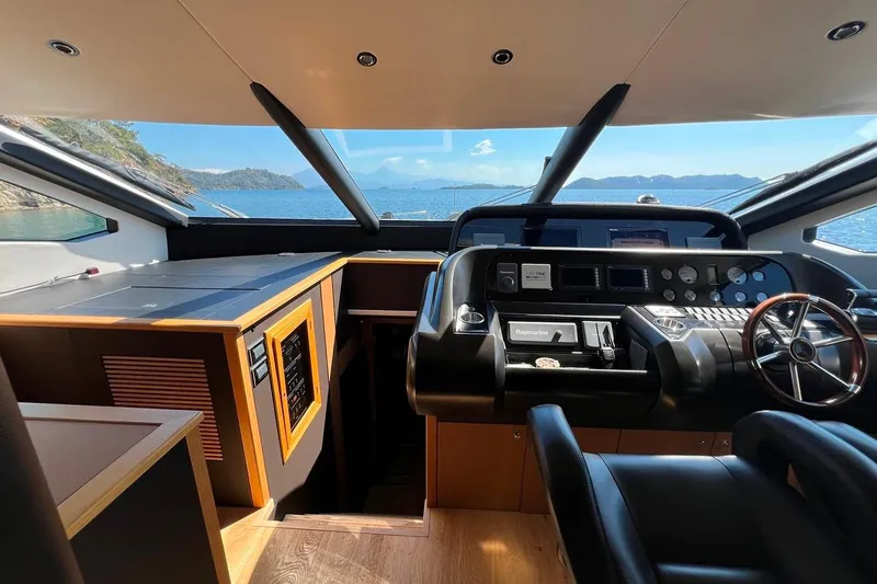  Yacht Photos Pics Luxurious Sunseeker 80 Yacht 2011 helm with panoramic ocean view and modern controls.