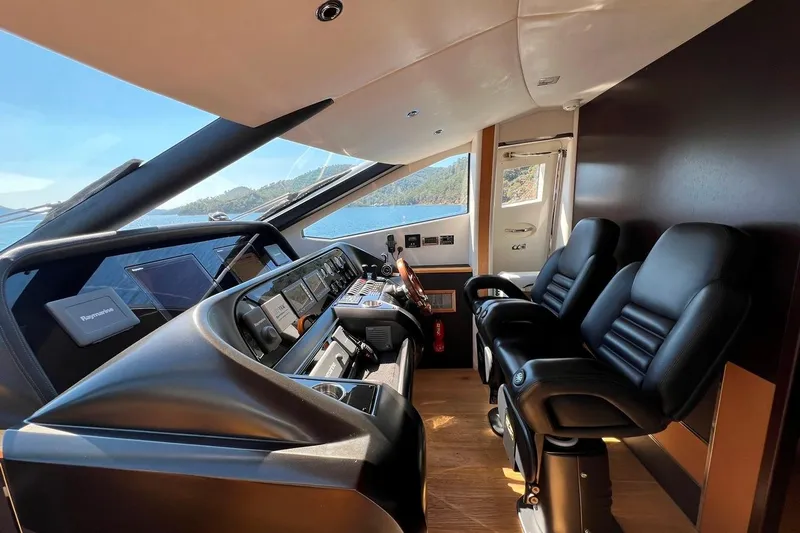 Yacht Photos Pics Luxurious Sunseeker 80 Yacht 2011 cockpit with modern controls and leather seating.