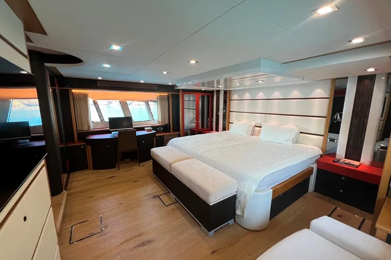 Yacht Photos Pics Luxurious bedroom interior of 2011 Sunseeker 80 Yacht with modern furnishings and large windows.
