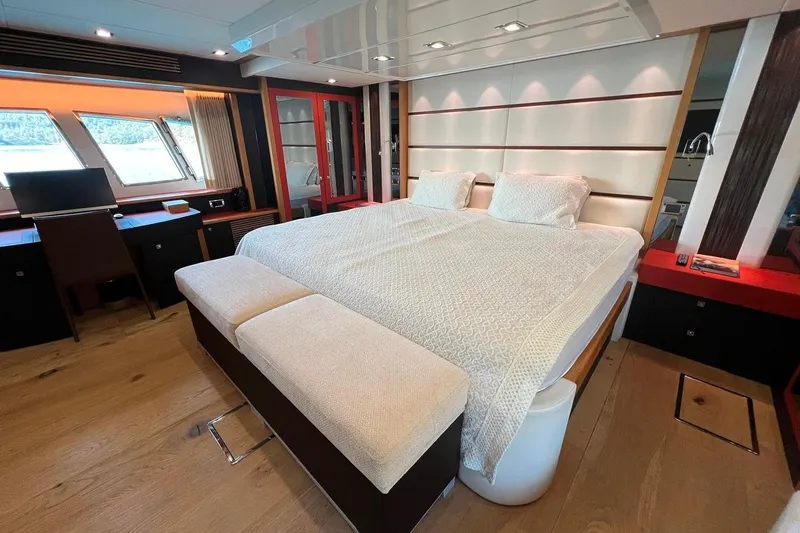  Yacht Photos Pics Luxurious bedroom interior of 2011 Sunseeker 80 Yacht with elegant furnishings and large windows.