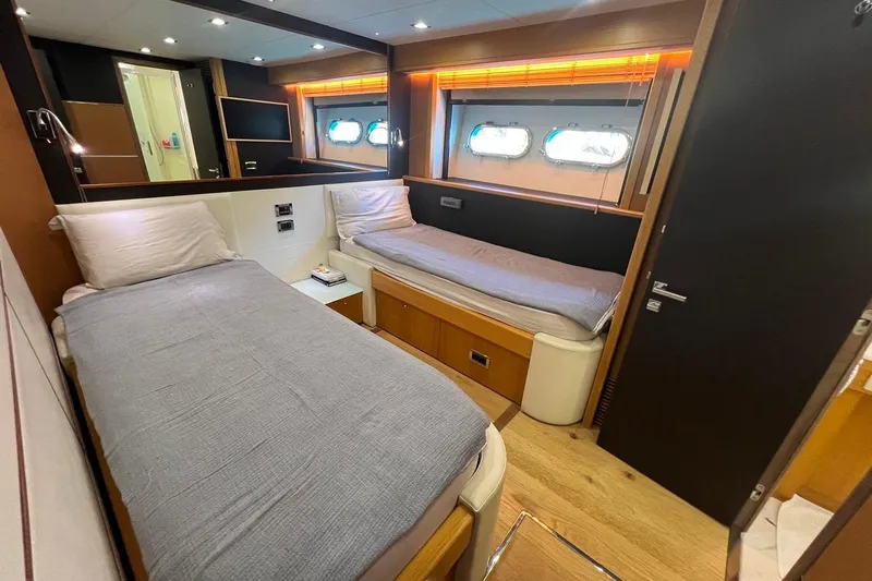  Yacht Photos Pics Luxurious twin cabin interior of 2011 Sunseeker 80 Yacht with modern design elements.