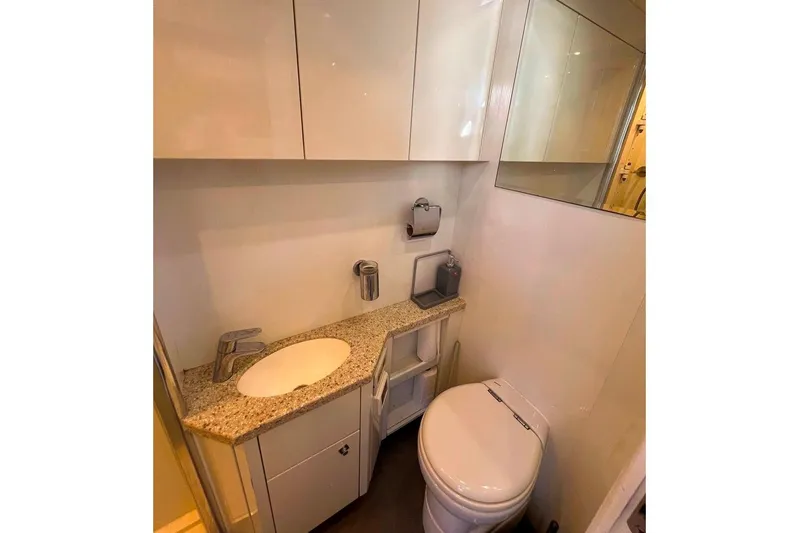  Yacht Photos Pics Luxurious bathroom in 2011 Sunseeker 80 Yacht with modern fixtures and granite countertop.