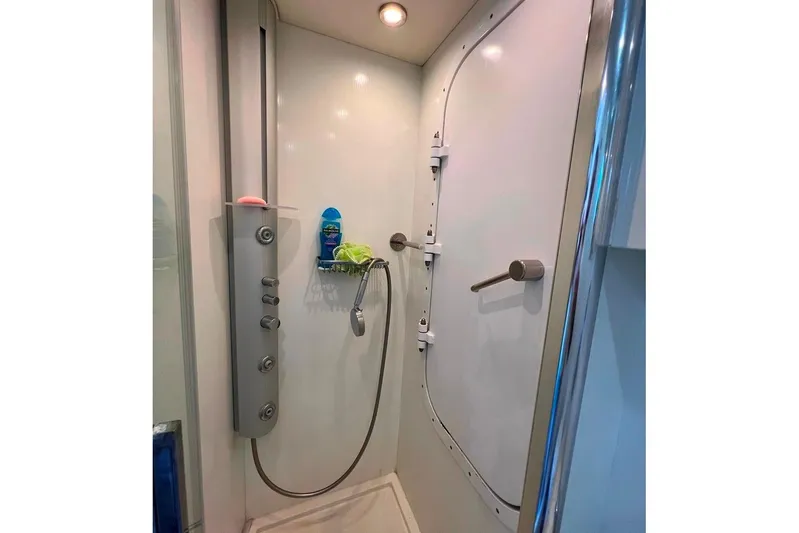  Yacht Photos Pics Shower area in 2011 Sunseeker 80 Yacht with modern fixtures and white interior.