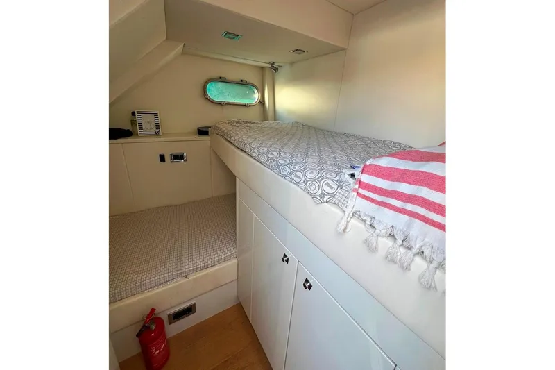  Yacht Photos Pics Cozy cabin interior of 2011 Sunseeker 80 Yacht with bunk beds and storage.