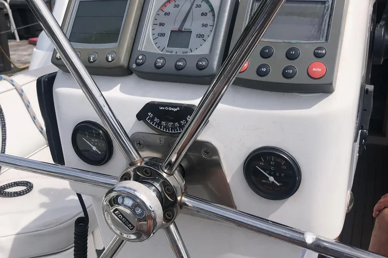 Tumblehome Yacht Photos Pics 1995 Little Harbor 51 Pilothouse helm with gauges and steering wheel.