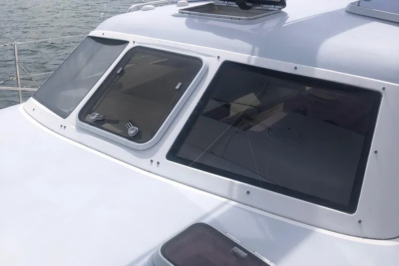 Tumblehome Yacht Photos Pics 1995 Little Harbor 51 Pilothouse yacht with sleek windows and ocean backdrop.