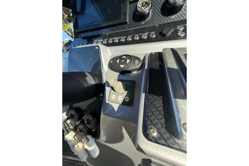  Yacht Photos Pics Control panel of a 2006 Lazer 40 boat with various switches and gauges.