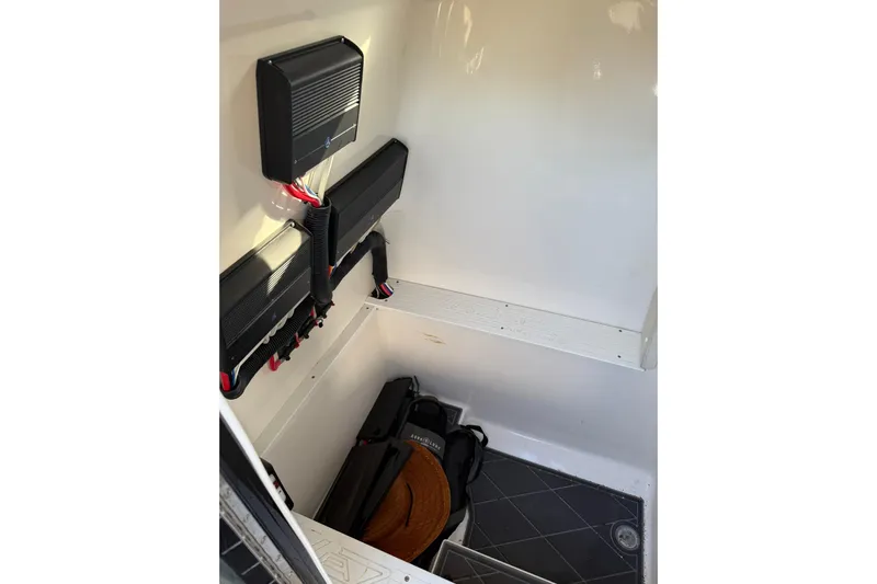  Yacht Photos Pics Interior of a 2006 Lazer 40 boat showing electrical components and storage area.